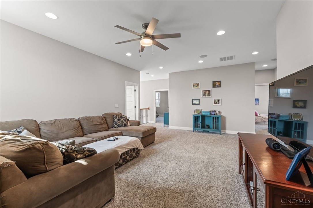 2425 Middleboro Road Clarksville, OH 45113 - Photo 59 of 91 This versatile living area features carpet flooring and recessed lighting, offering comfort and style.