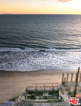 a view of a lake from a wooden floor