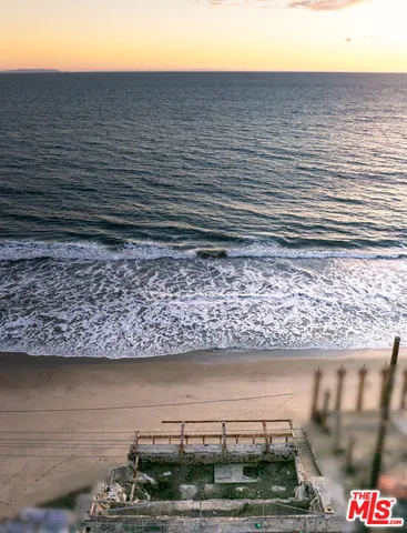 a view of a lake from a wooden floor