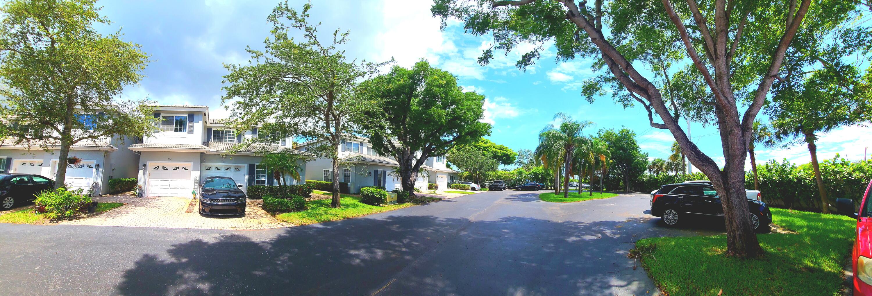 5121 Sabal Gardens Lane, Unit 2 Boca Raton, FL 33487 - Photo 24 of 25 a view of road with trees