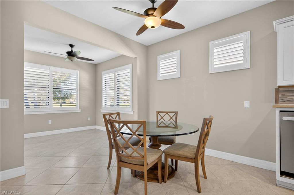 6345 Liberty Street Ave Maria, FL 34142 - Photo 12 of 35 a dining room with furniture and window
