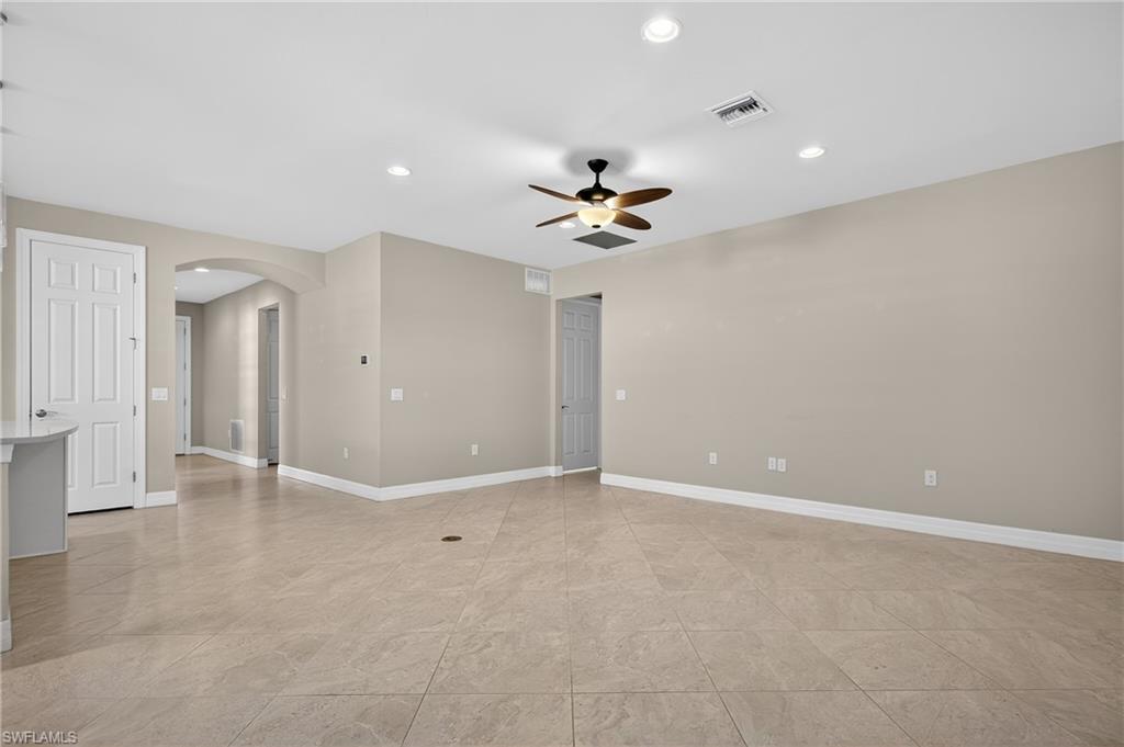 6345 Liberty Street Ave Maria, FL 34142 - Photo 16 of 35 a view of an empty room with a ceiling fan