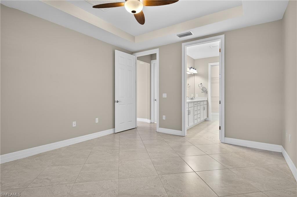 6345 Liberty Street Ave Maria, FL 34142 - Photo 19 of 35 an empty room with a bathroom and a mirror