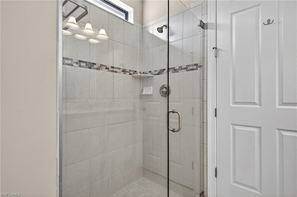 6345 Liberty Street Ave Maria, FL 34142 - Photo 21 of 35 a bathroom with a shower