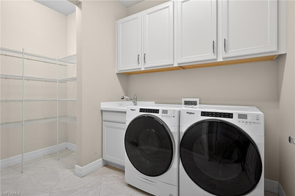 6345 Liberty Street Ave Maria, FL 34142 - Photo 26 of 35 a utility room with dryer and washer