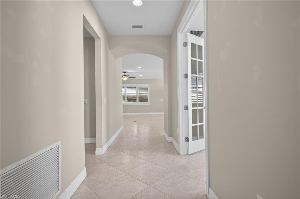 6345 Liberty Street Ave Maria, FL 34142 - Photo 5 of 35 an entryway with a white walls