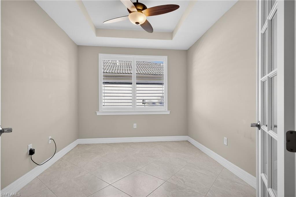 6345 Liberty Street Ave Maria, FL 34142 - Photo 7 of 35 a view of room with a ceiling fan and window