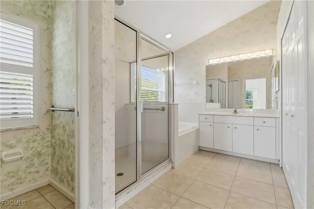 a bathroom with a double vanity sink and mirror