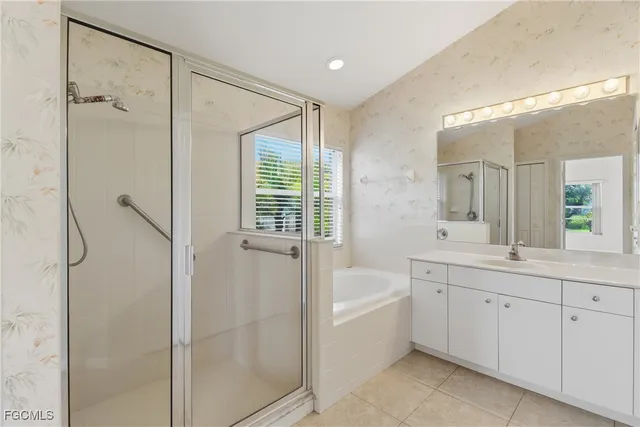 an empty room with a chandelier fan