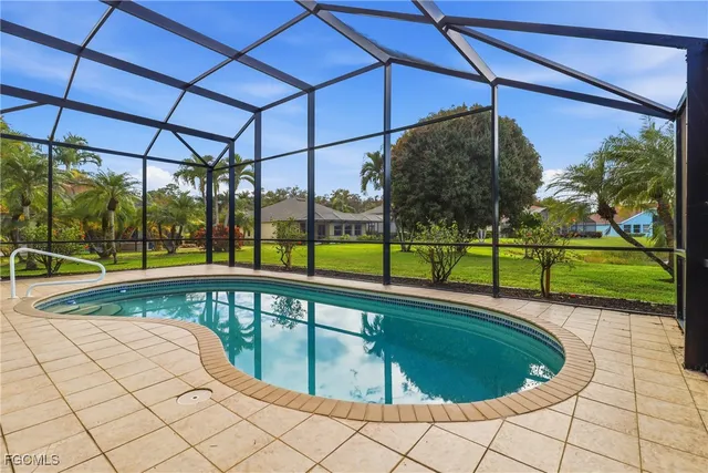 a view of a swimming pool with a lounge chairs