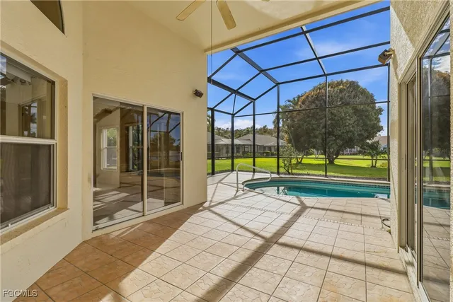 a view of a house with a yard and sitting area
