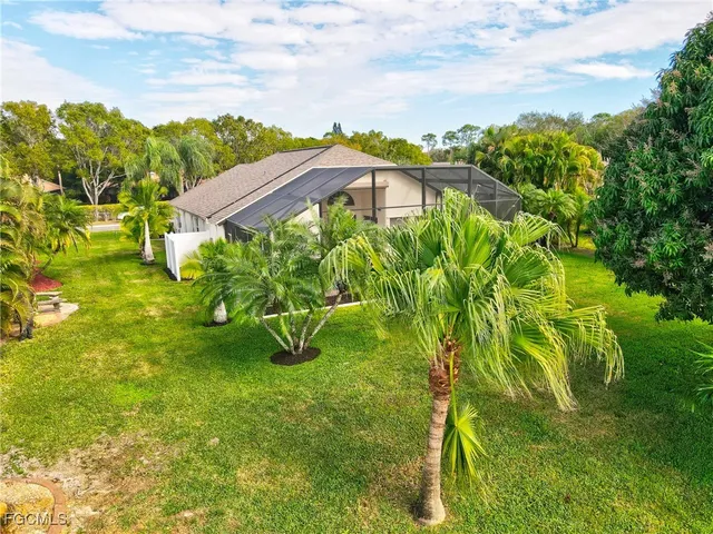 an aerial view of house with yard