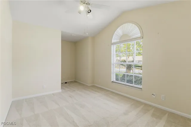 an empty room with windows and natural light