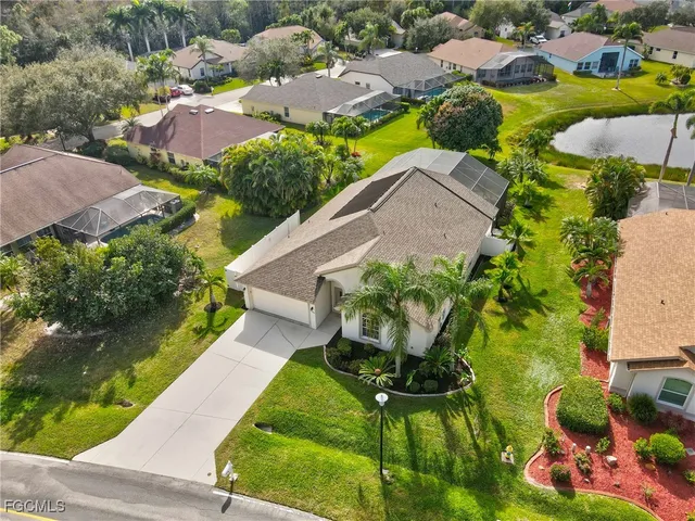 an aerial view of residential house with outdoor space and swimming pool