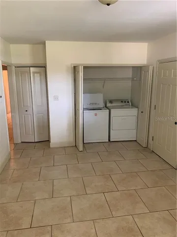 a view of a tree in a yard