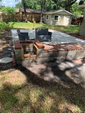 a house with a big yard and large trees