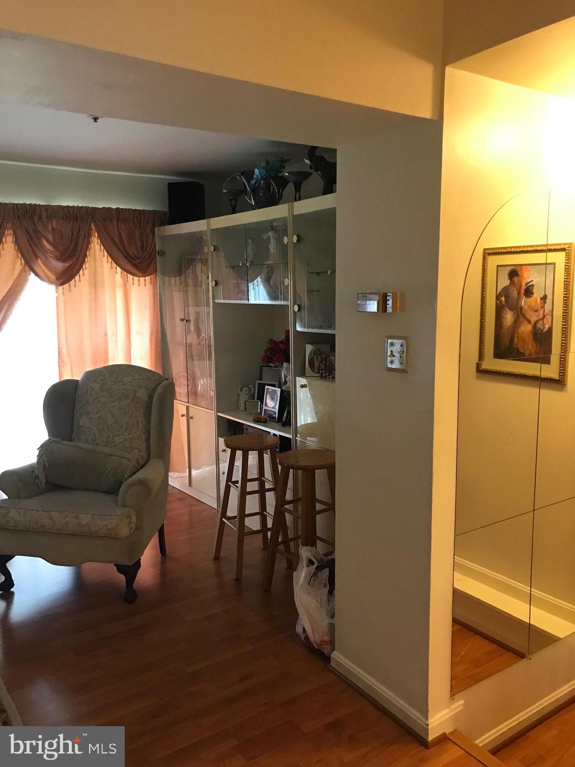 8501 Ritchboro Road District Heights, MD 20747 - Photo 15 of 17 a living room with furniture and a wooden floor