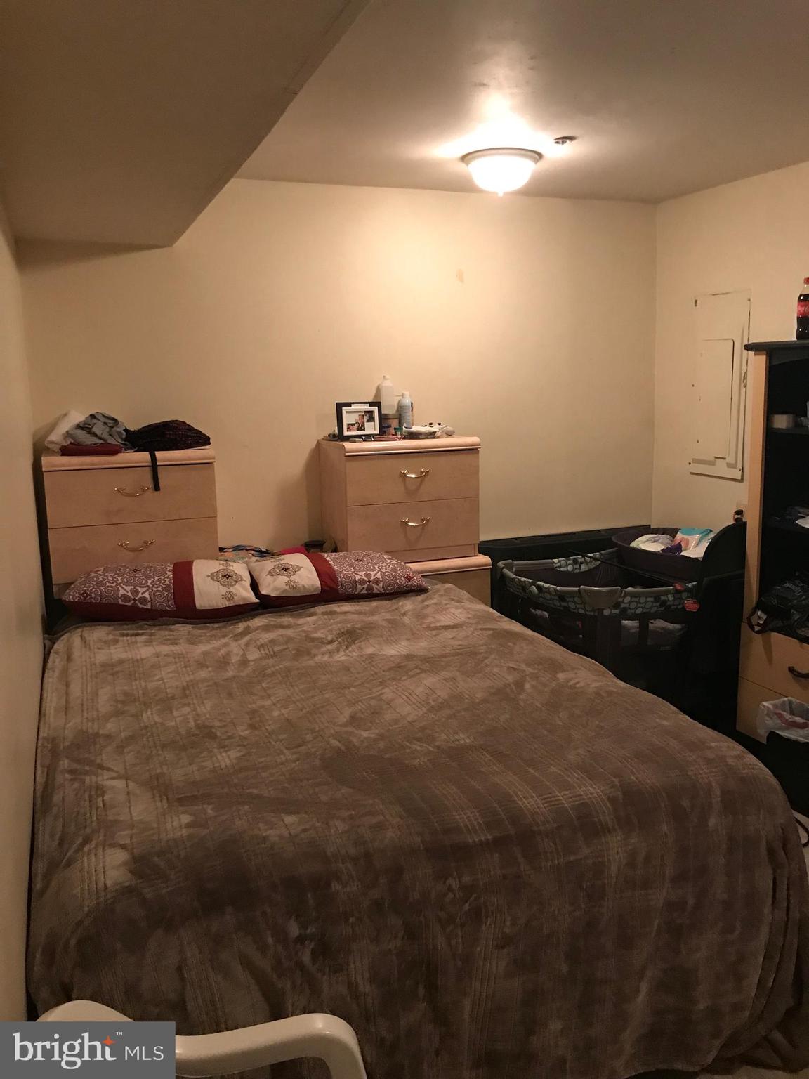8501 Ritchboro Road District Heights, MD 20747 - Photo 10 of 17 a bedroom with a bed and a night stand