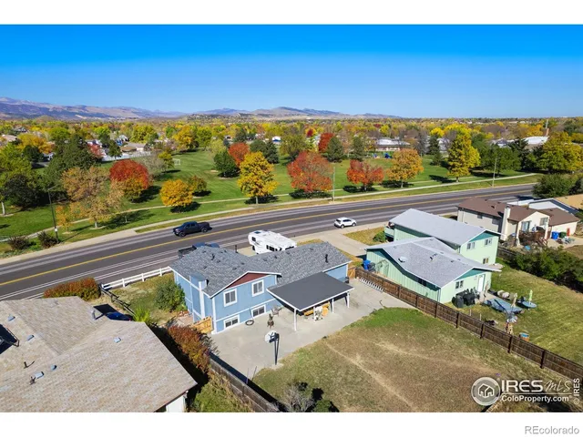 an aerial view of a house with swimming pool