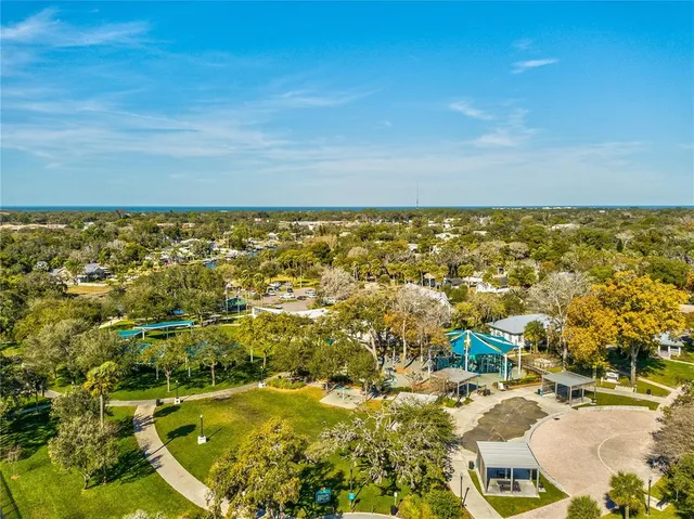 an aerial view of a city with lawn chairs