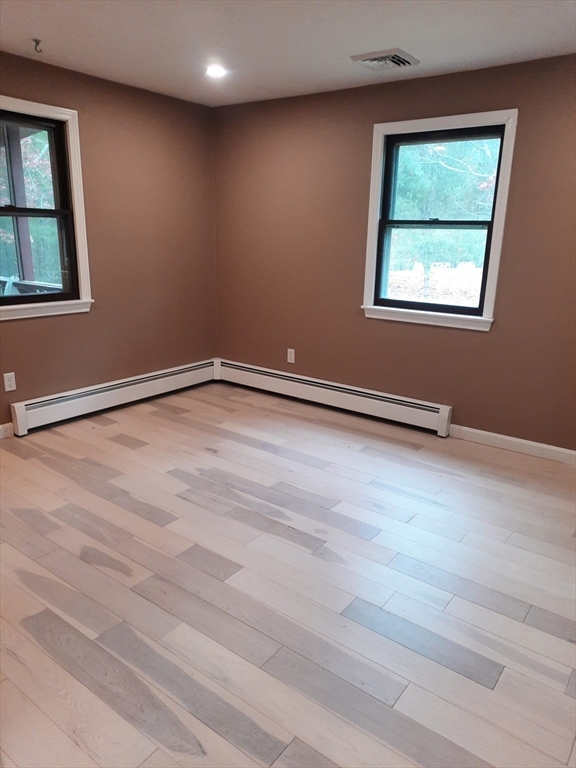 633 Wareham Road, Unit 1 Plymouth, MA 02360 - Photo 4 of 12 an empty room with windows