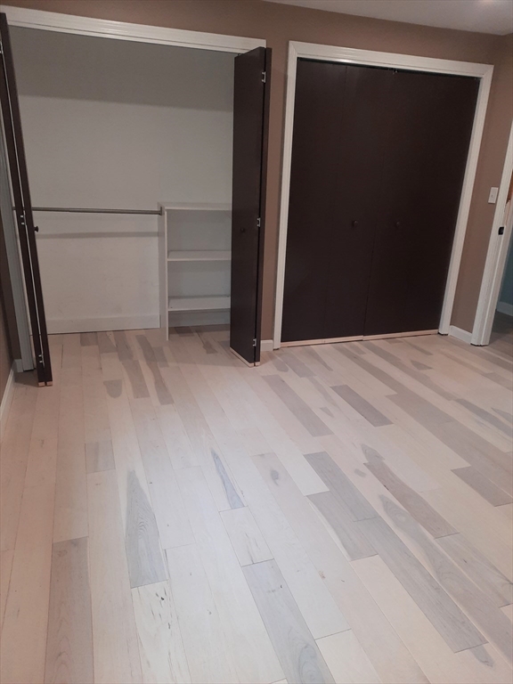 633 Wareham Road, Unit 1 Plymouth, MA 02360 - Photo 5 of 12 a view of an empty room with closet and a window