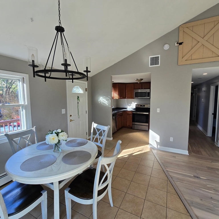 633 Wareham Road, Unit 1 Plymouth, MA 02360 - Photo 9 of 12 a view of a dining room with furniture