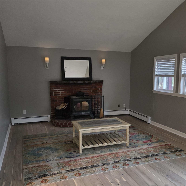 633 Wareham Road, Unit 1 Plymouth, MA 02360 - Photo 10 of 12 a living room with a fireplace