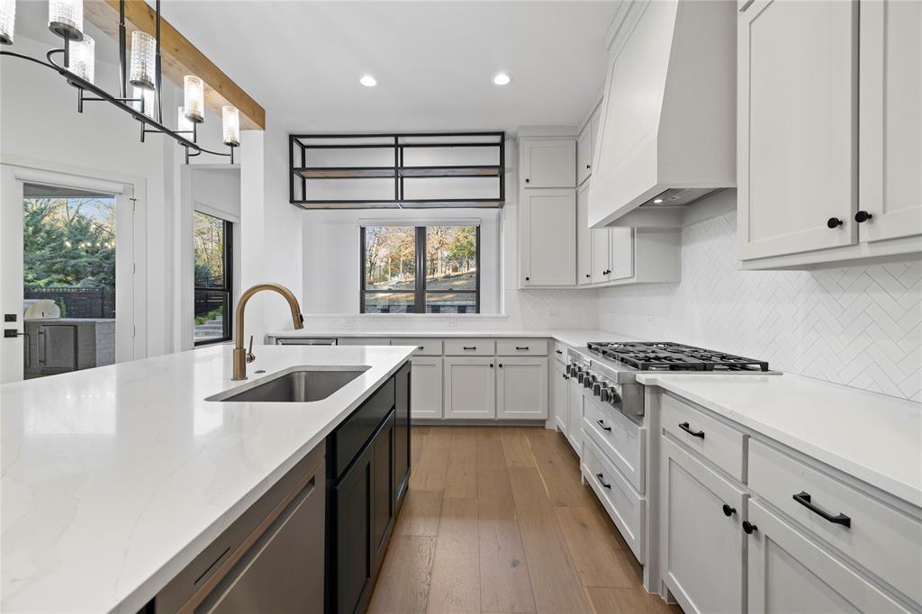 2432 Bellview Circle Tyler, TX 75709 - Photo 11 of 40 a kitchen with stainless steel appliances granite countertop a sink stove and cabinets