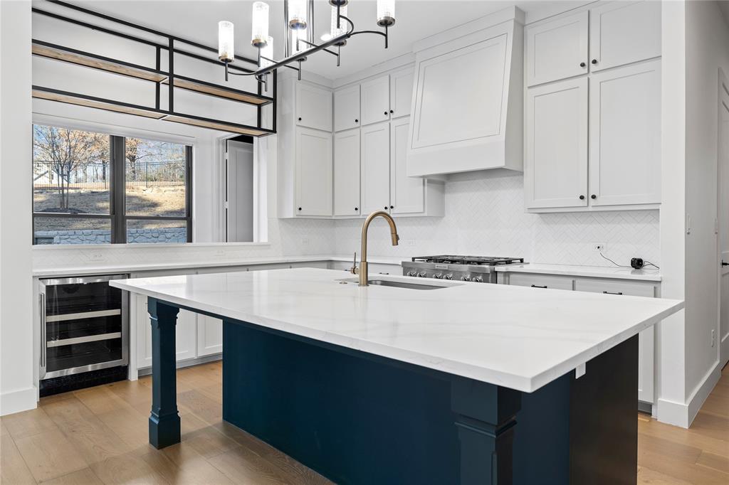 2432 Bellview Circle Tyler, TX 75709 - Photo 15 of 40 a kitchen with a sink cabinets and window
