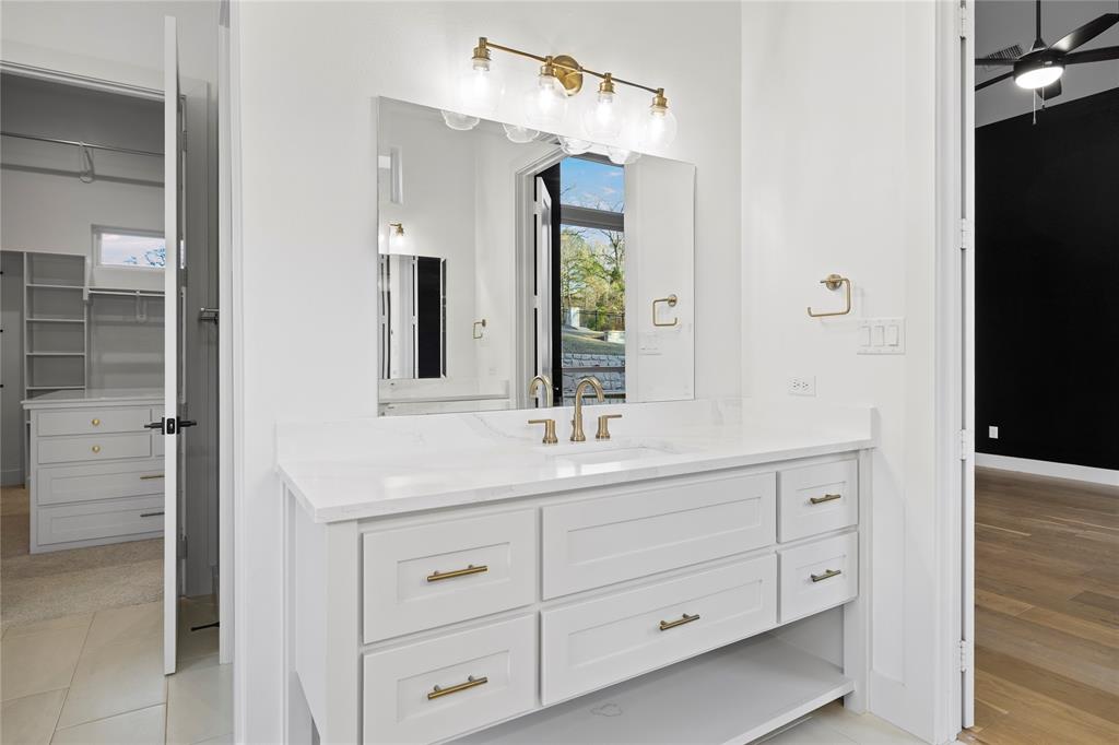 2432 Bellview Circle Tyler, TX 75709 - Photo 23 of 40 a bathroom with a double vanity sink and mirror