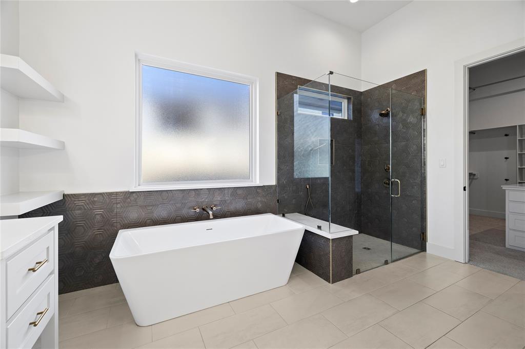 2432 Bellview Circle Tyler, TX 75709 - Photo 24 of 40 a bathroom with a bathtub and shower