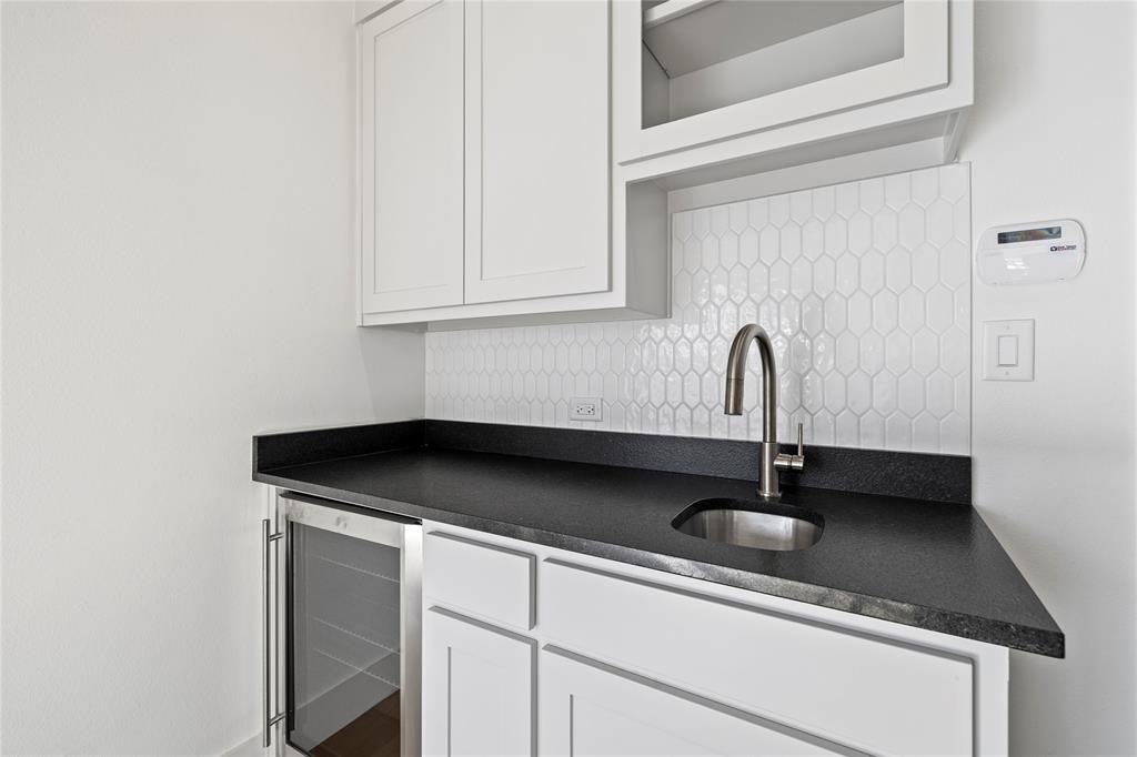 2432 Bellview Circle Tyler, TX 75709 - Photo 28 of 40 a kitchen with a sink and cabinets