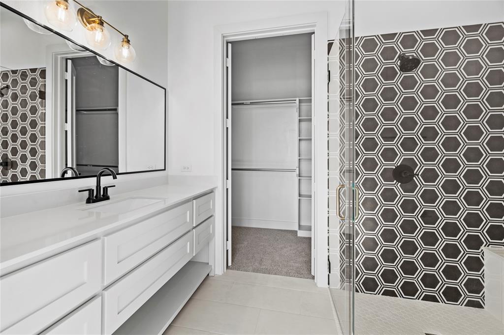 2432 Bellview Circle Tyler, TX 75709 - Photo 32 of 40 a bathroom with a double vanity sink mirror and shower