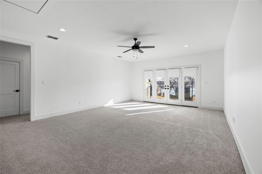 2432 Bellview Circle Tyler, TX 75709 - Photo 33 of 40 en empty room with fan and windows