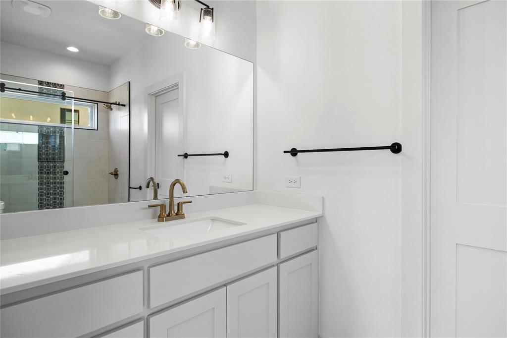 2432 Bellview Circle Tyler, TX 75709 - Photo 35 of 40 a bathroom with a sink and a mirror