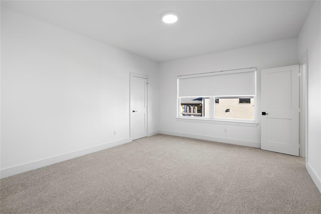 2432 Bellview Circle Tyler, TX 75709 - Photo 38 of 40 an empty room with a fireplace and painted walls