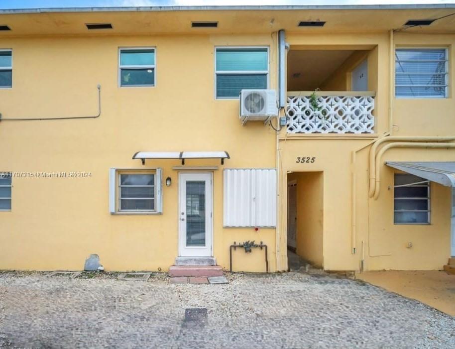 3525 Polk Street, Unit 5 Hollywood, FL 33021 - Photo 11 of 12 Back of structure - Accordion Shutters