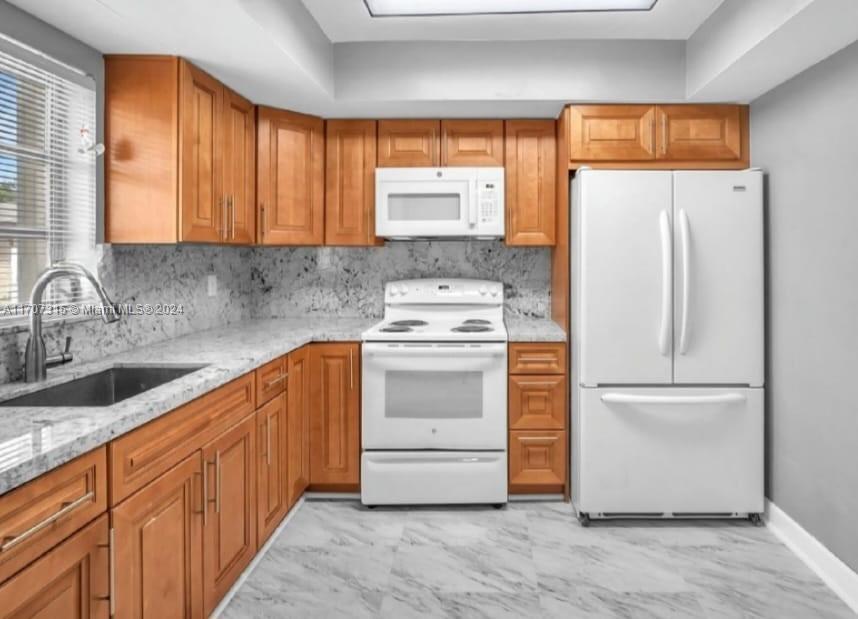 3525 Polk Street, Unit 5 Hollywood, FL 33021 - Photo 3 of 12 Big size fridge and newer appliances