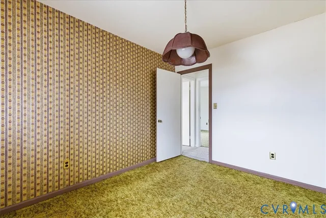 an empty room with closet area