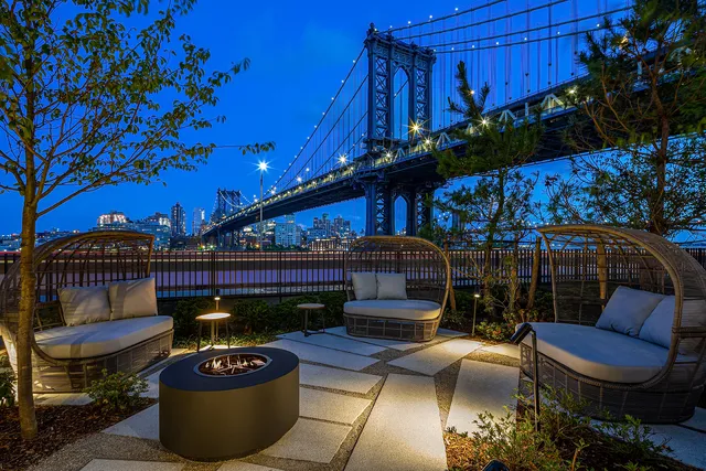 a view of a patio with couches chairs and potted plants