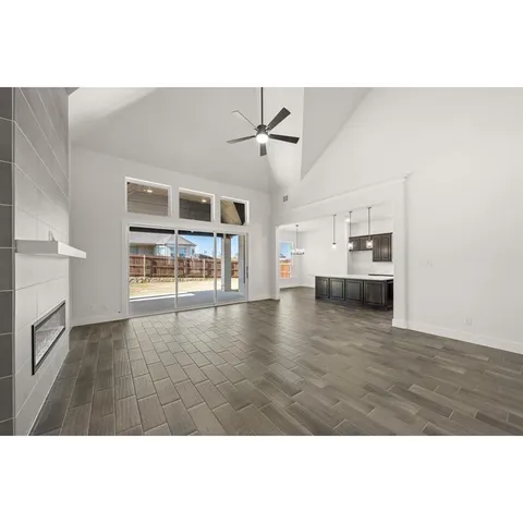 a open living room with kitchen island furniture and wooden floor