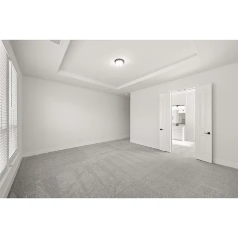 a view of empty room with wooden floor and fireplace