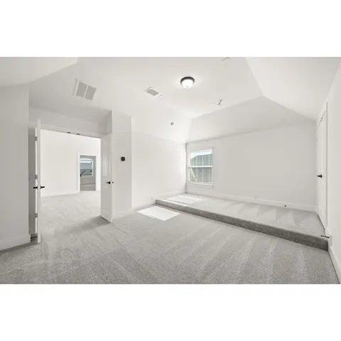 a view of porch with a chair and floor to ceiling window