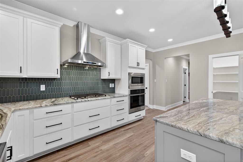 127 Sitka Loop Haughton, LA 71037 - Photo 11 of 29 a kitchen with granite countertop a sink and cabinets