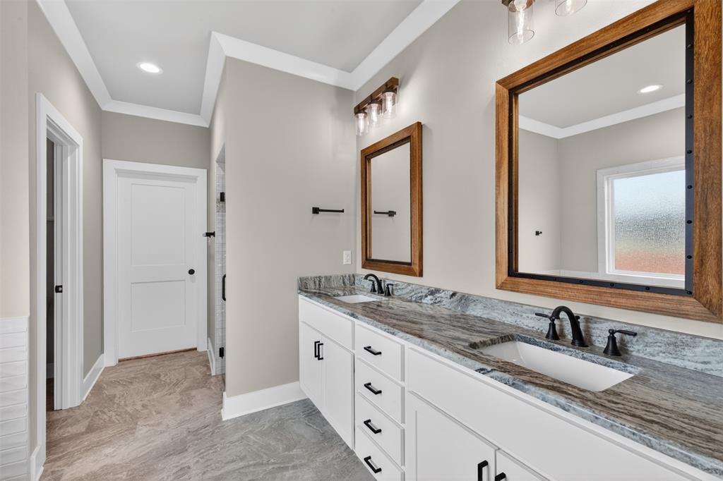 127 Sitka Loop Haughton, LA 71037 - Photo 17 of 29 a bathroom with double sink and a mirror