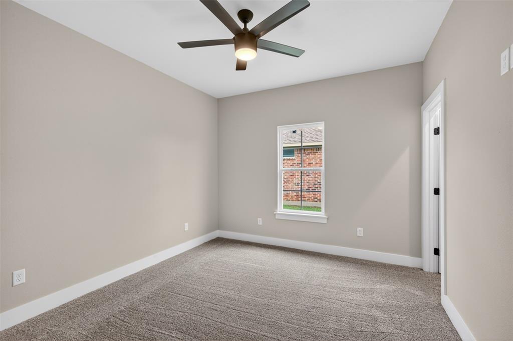 127 Sitka Loop Haughton, LA 71037 - Photo 23 of 29 an empty room with a window and a fan