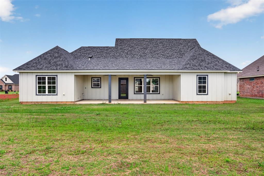 127 Sitka Loop Haughton, LA 71037 - Photo 27 of 29 a view of a house with a backyard