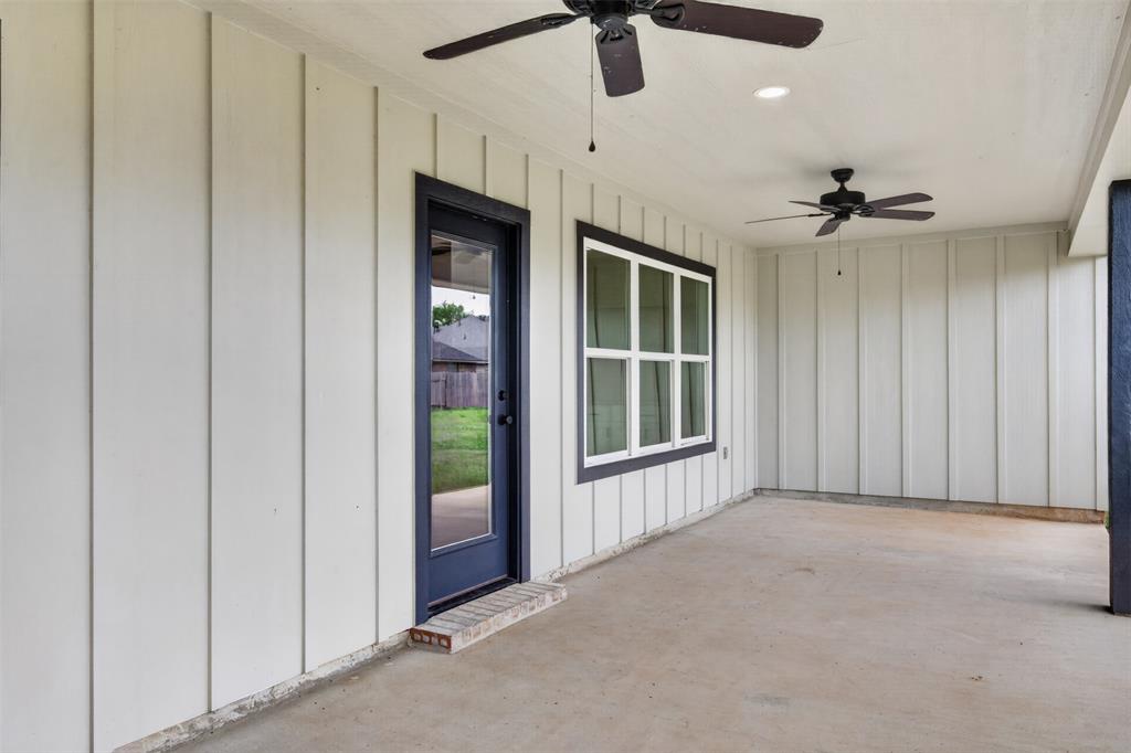 127 Sitka Loop Haughton, LA 71037 - Photo 29 of 29 an empty room with ceiling fan and windows