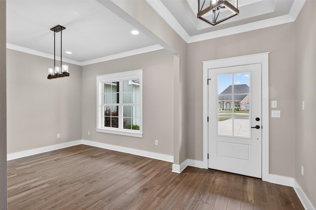 127 Sitka Loop Haughton, LA 71037 - Photo 4 of 29 a view of an empty room with a window and wooden floor